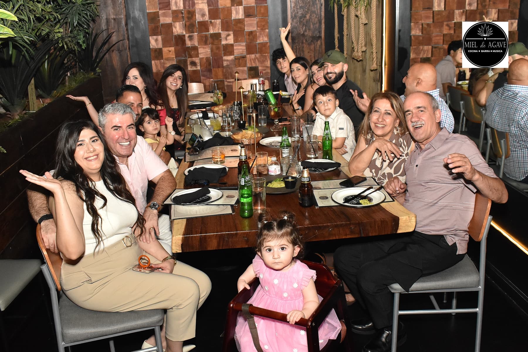 A multigenerational family gathered for dinner at Miel de Agave