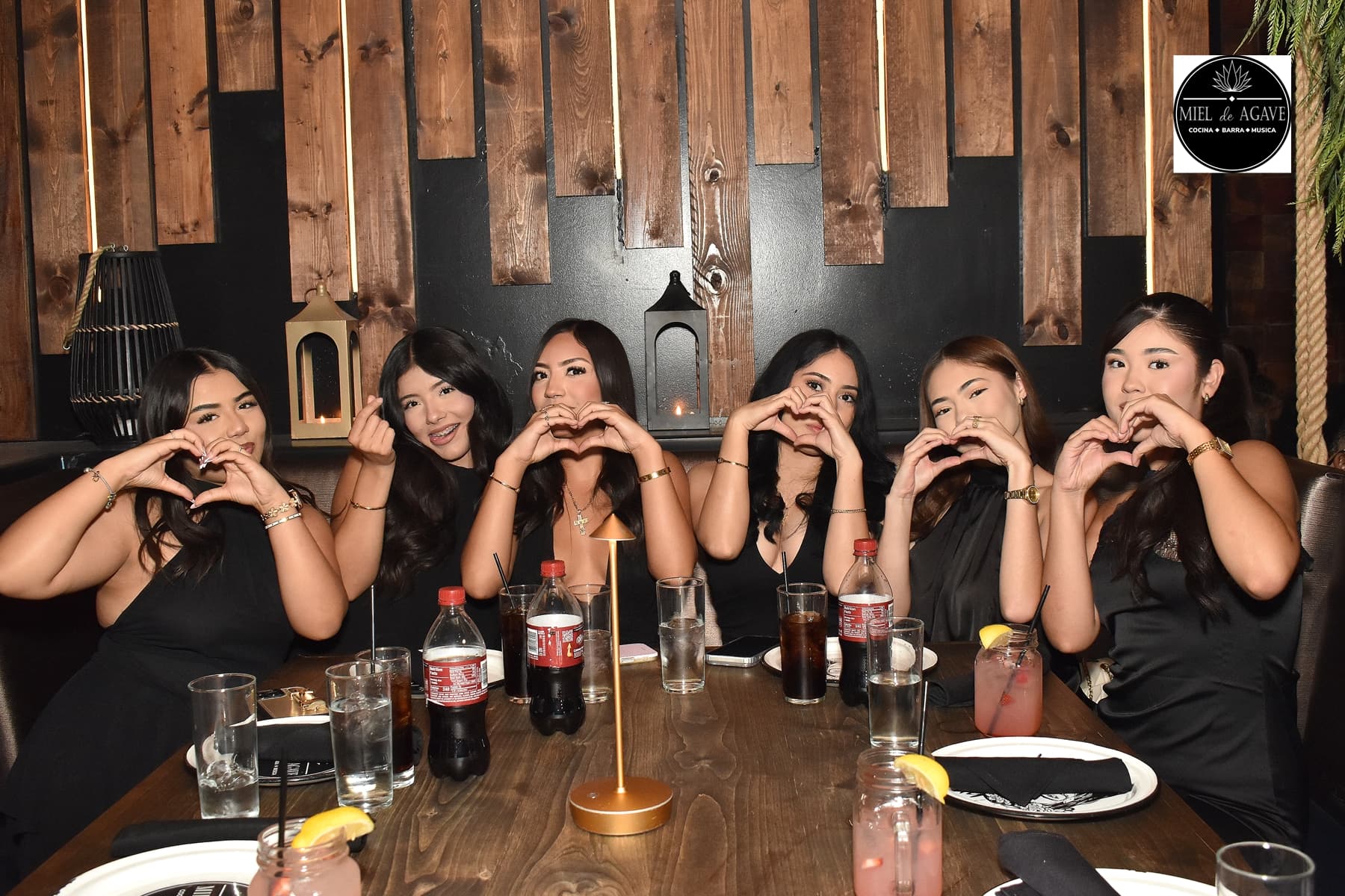 A group of friends celebrating together at Miel de Agave