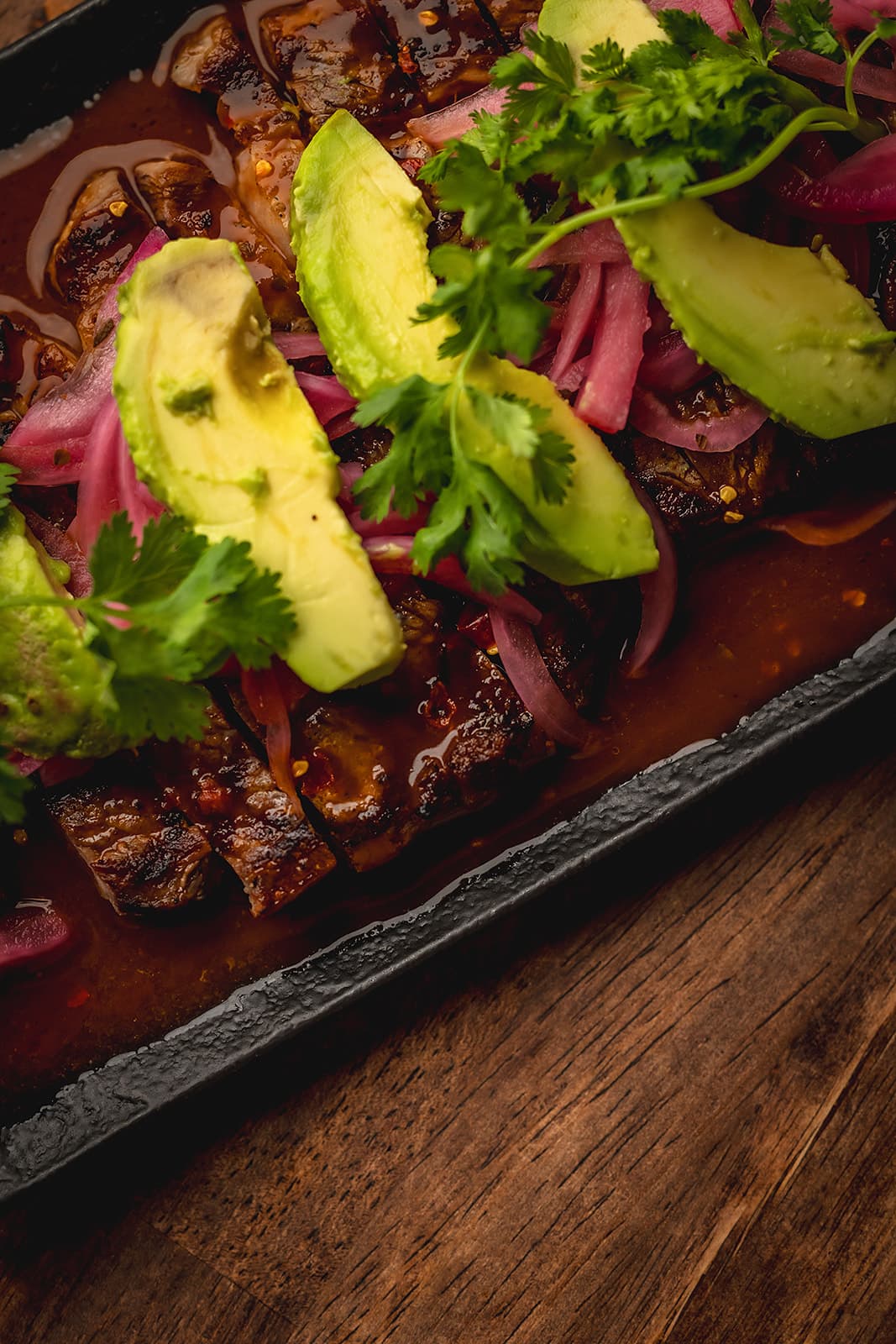 Ribeye aguachile with avocado and pickled red onion